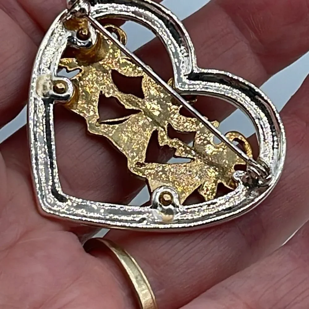 Vintage heart Angel trio Aura Borealis brooch.
